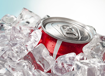 Happy employee drinking a hot latte in her office